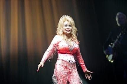 Dolly Parton Inspired Lottery Winner to Give Away $77M