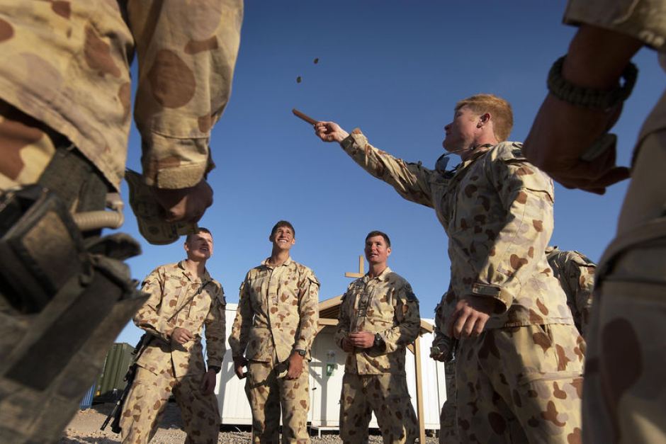 Soldiers playing a game of 2 Up