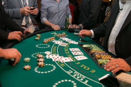 Some punters playing blackjack at a live casino