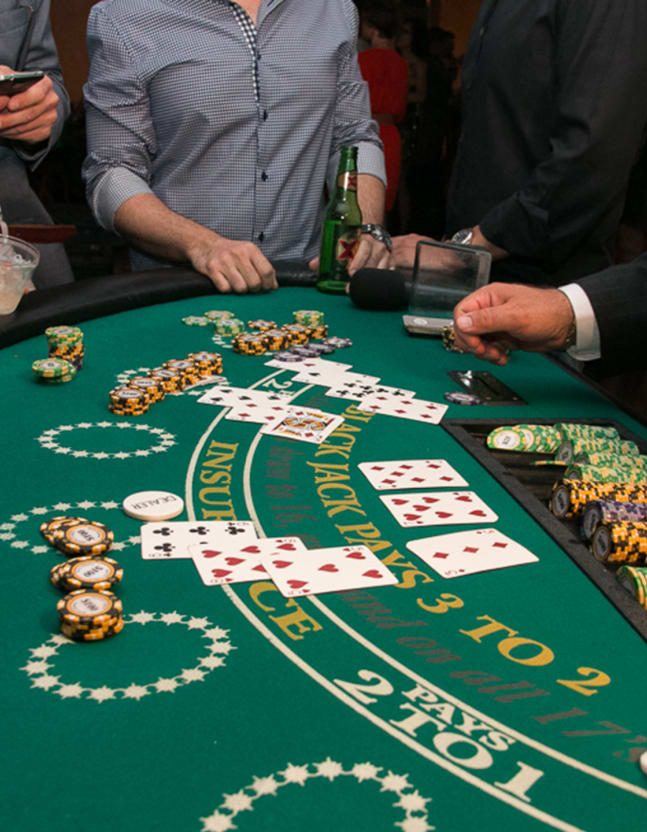 Some punters playing blackjack at a live casino