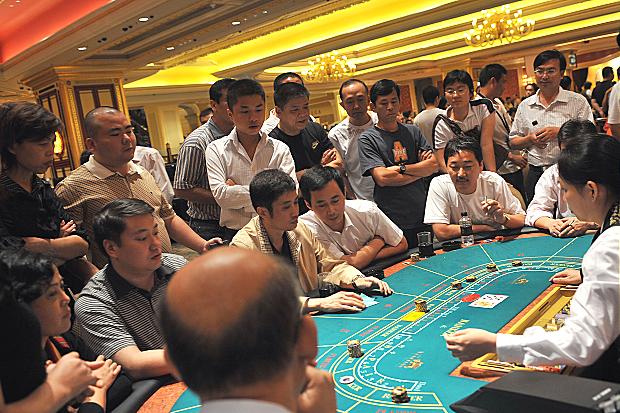 Chinese gamblers playing baccarat