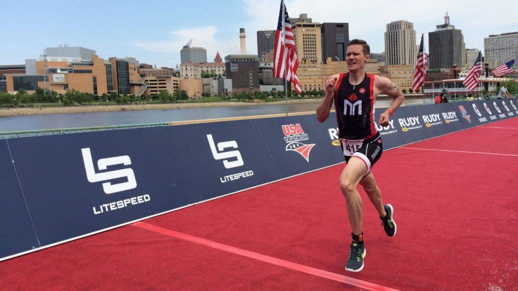 Athlete Chris Mosier at finishing line