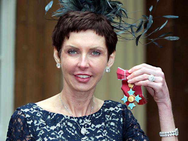 Denise Coates receiving her honour of Commander of the Order of the British Empire