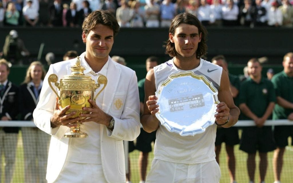 Federer and Nadal with their Wimbledon trophies