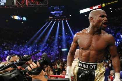 Floyd Mayweather celebrating after a fight