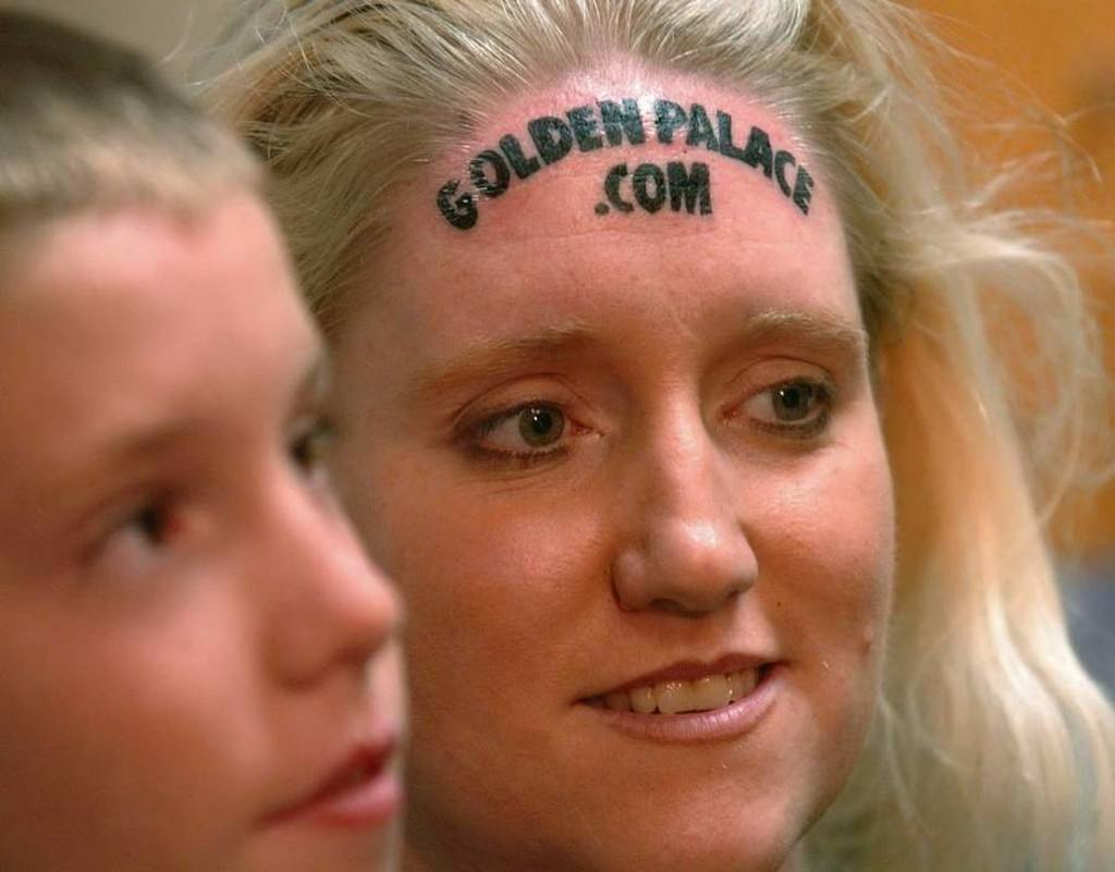 Women's casino site forehead tattoo