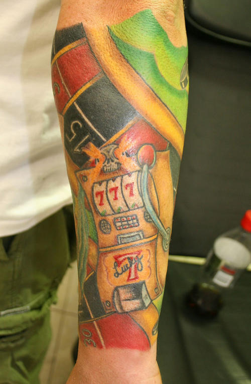 Multi-colored gambling sleeve tattoo