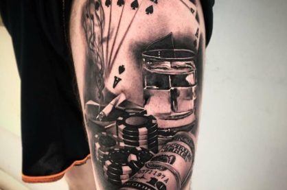 Casino-themed leg tattoo