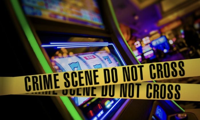 Crime scene taped across a slot machine cabinet