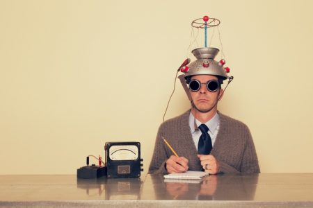 Man with brain testing equipment.