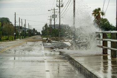 Water crashing over a road near Galveston Bay just outside of Houston Texas during Hurricane Harvey