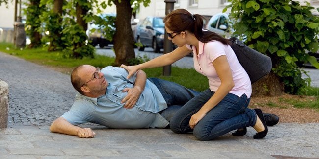 An image showing someone falling down suffering from a heart attack