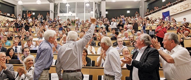 Physicists celebrating the higgs boson discovery