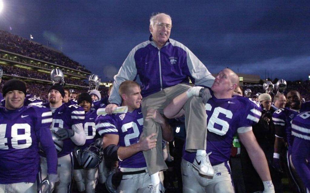 Kansas State players celebrating a famous win with their coach