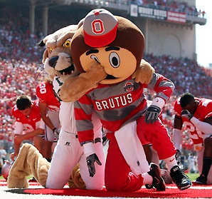 two football mascots fight
