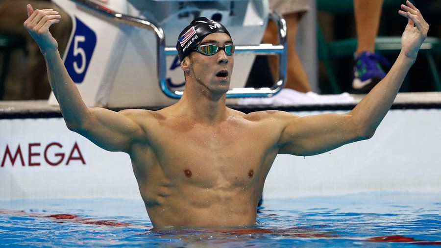 An image of Michael Phelps in the pool after winning a race