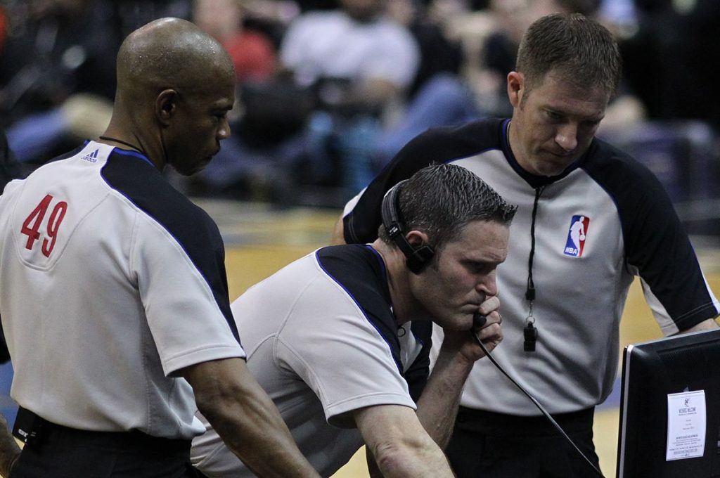 NBA Referees reviewing a decision from during the game