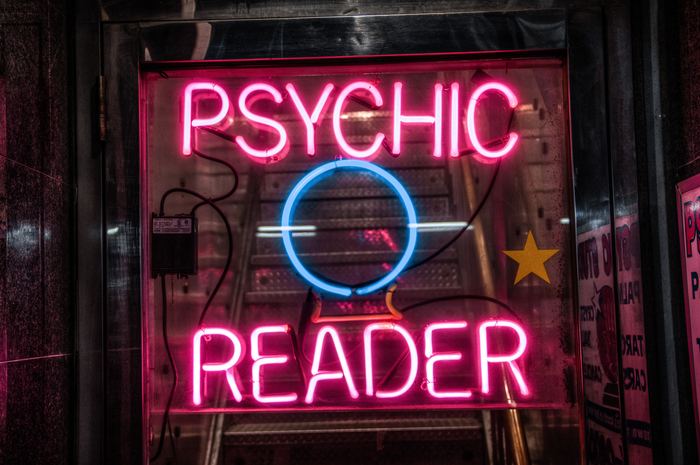 A neon sigh advertising a psychic reader