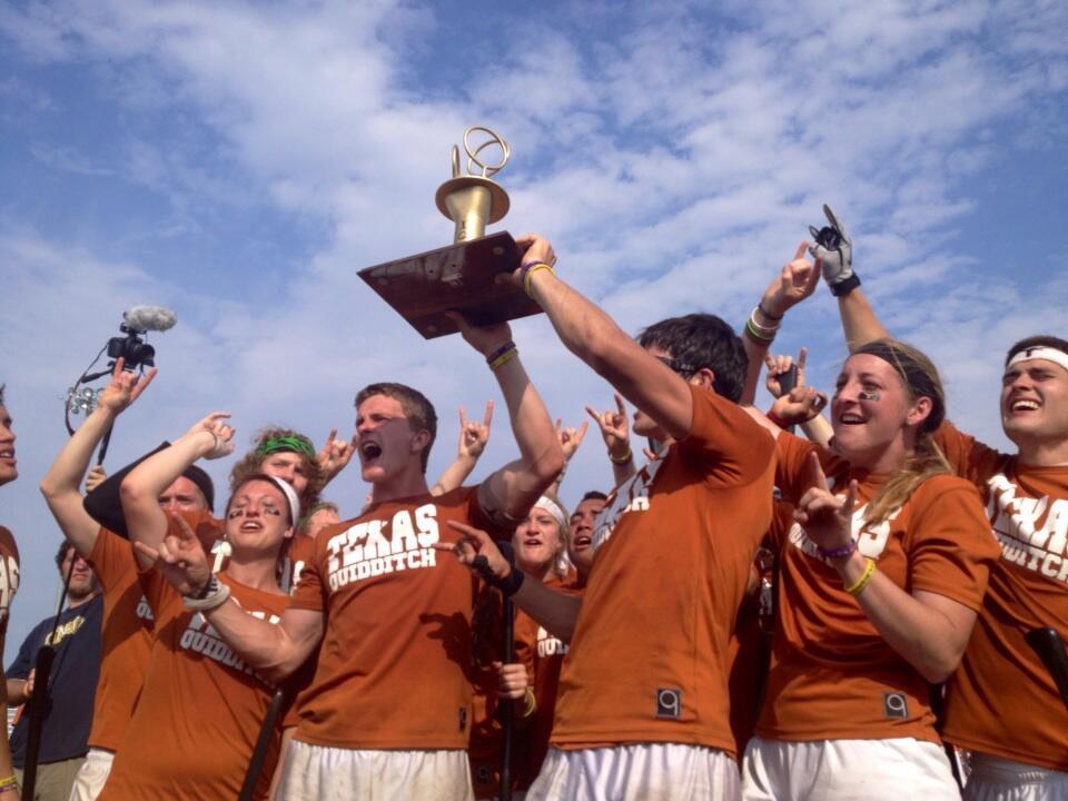 A team lifting the trophy from a quidditch cup