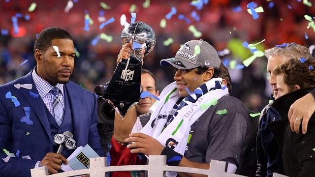 Russell Wilson of the Seattle Seahawks lifting the Vince Lombardi trophy