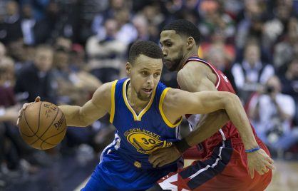 Stephen Curry of the Golden State Warriors against Garrett Temple of the Washington Wizards.