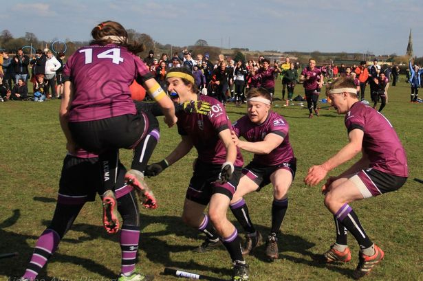 A quidditch team celebrating a game win