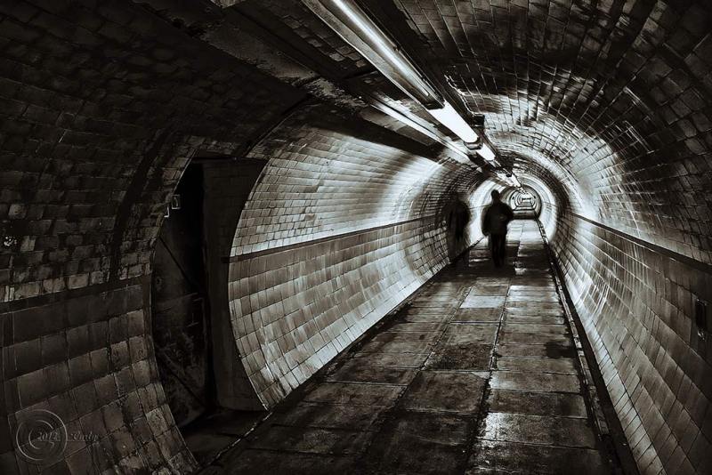 A dark tunnel where people may seek shelter