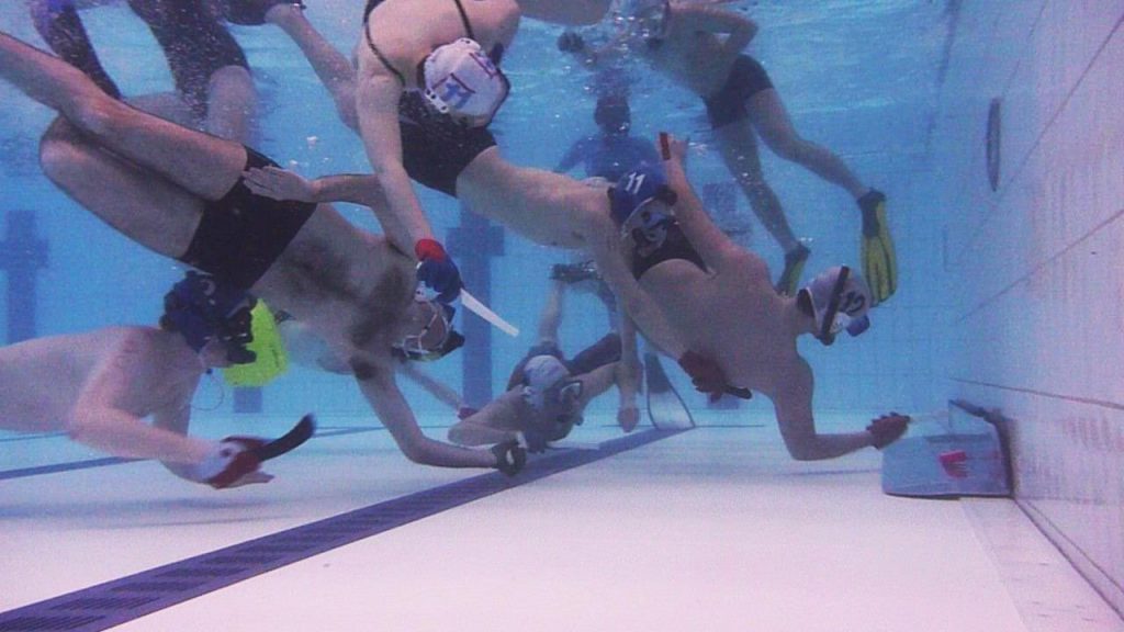 Players competing in Underwater Hockey