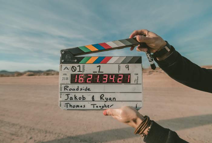 A clapperboard signalling the next scene of a film/tv show