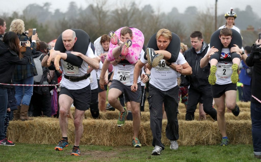 Husbands competing in Wife Carrying