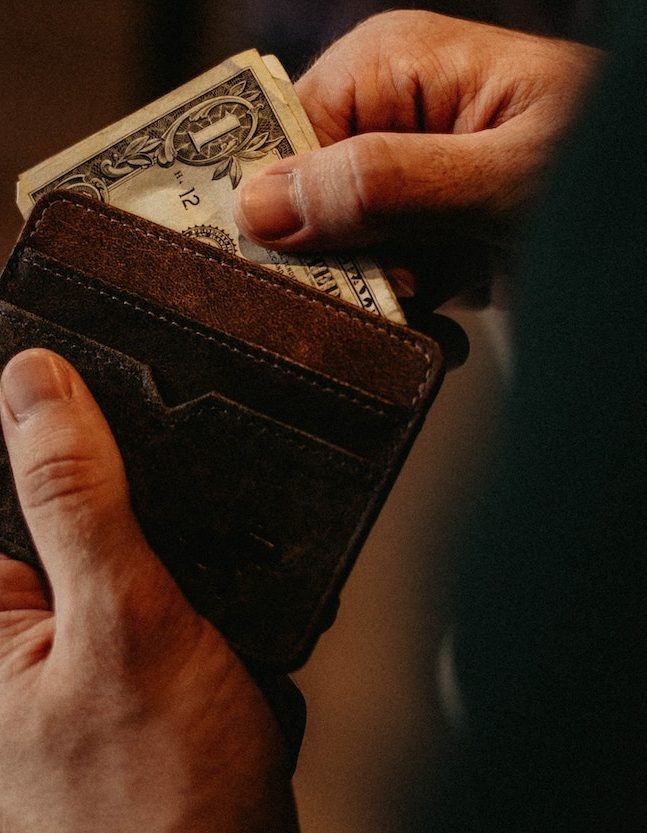 Person getting money out of wallet