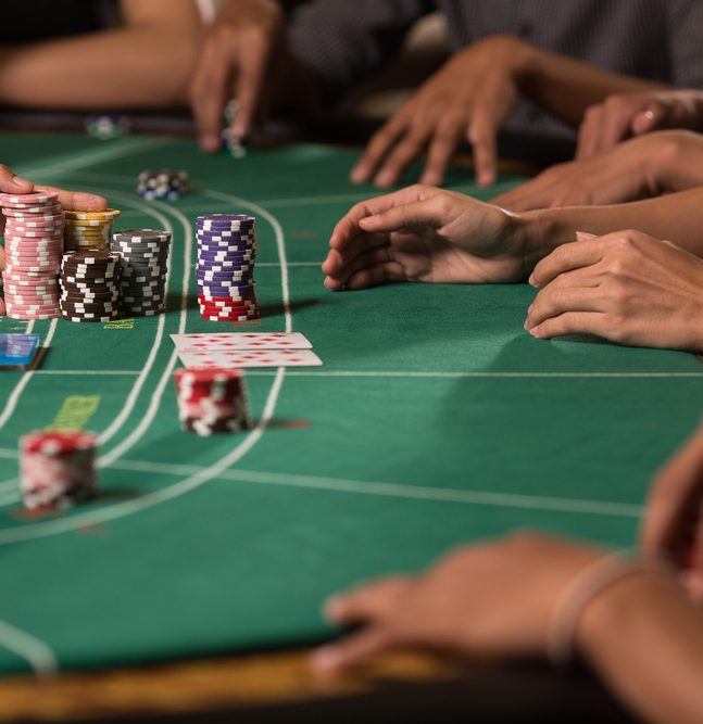 Player winning chip by betting baccarat with banker hand