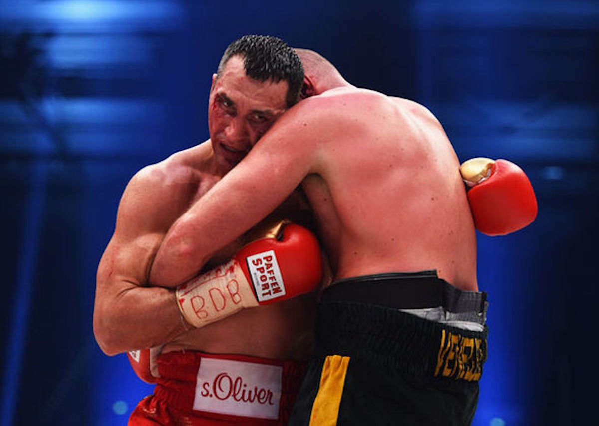 Why do boxers hug in the ring?