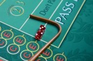Dice and stick on craps table