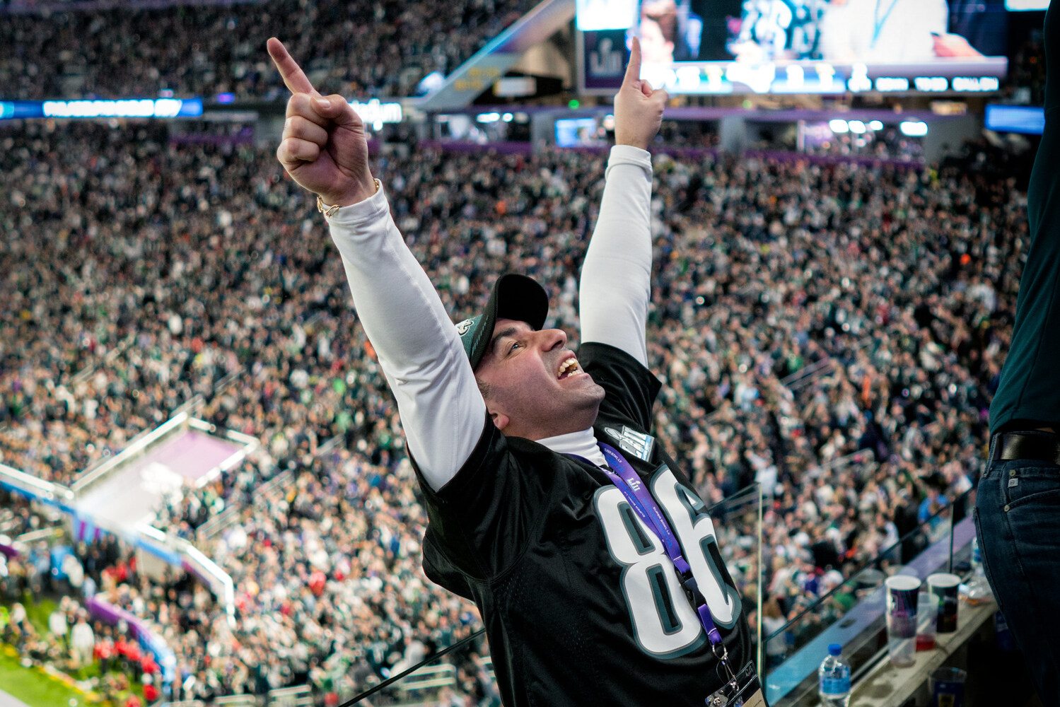 An Eagles fan celebrates in the stands at Super Bowl LII