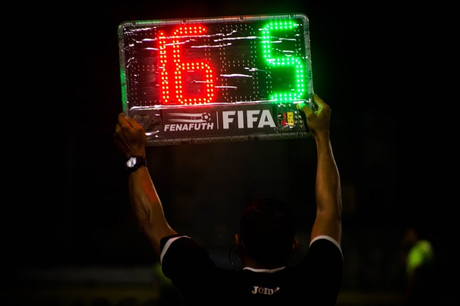 FIFA ref holding score