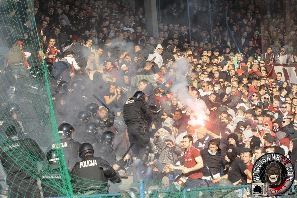 FK Sarajevo fans clashing with riot police during a game