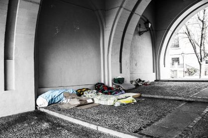 Sleeping bags under an archway.