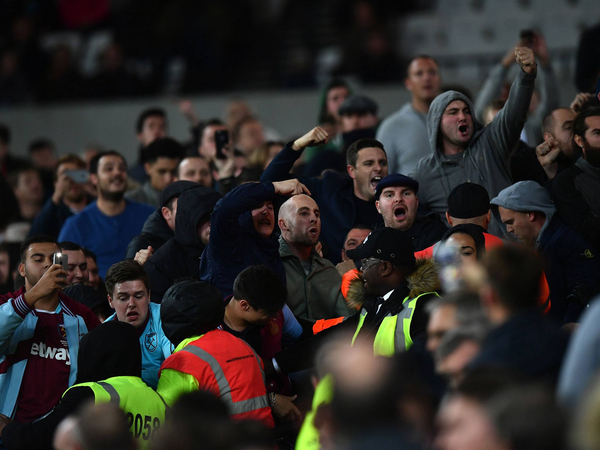An image of football fans intimidating the opposing fans