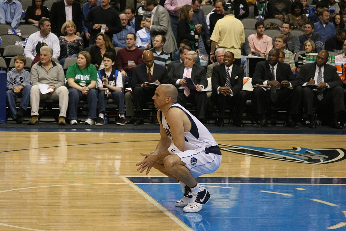 Jason Kidd squats on the court