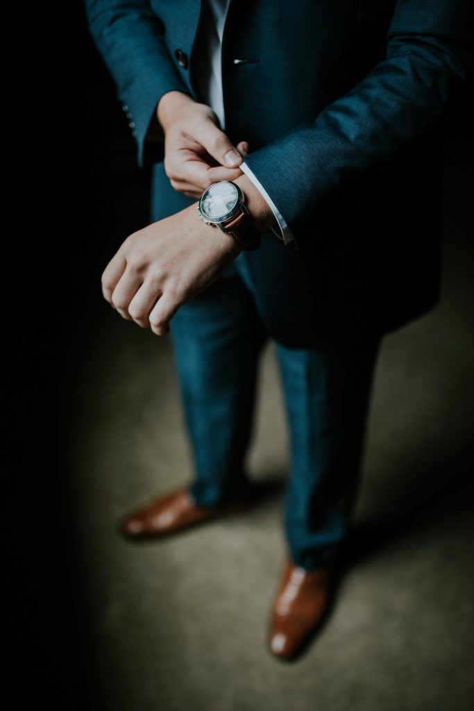 Man holding his black suit