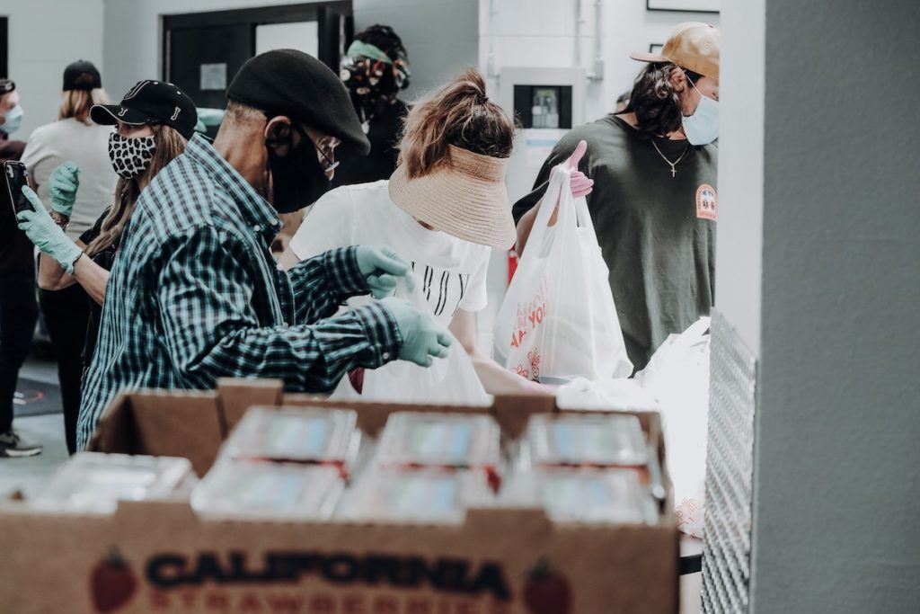 Volunteers giving food support
