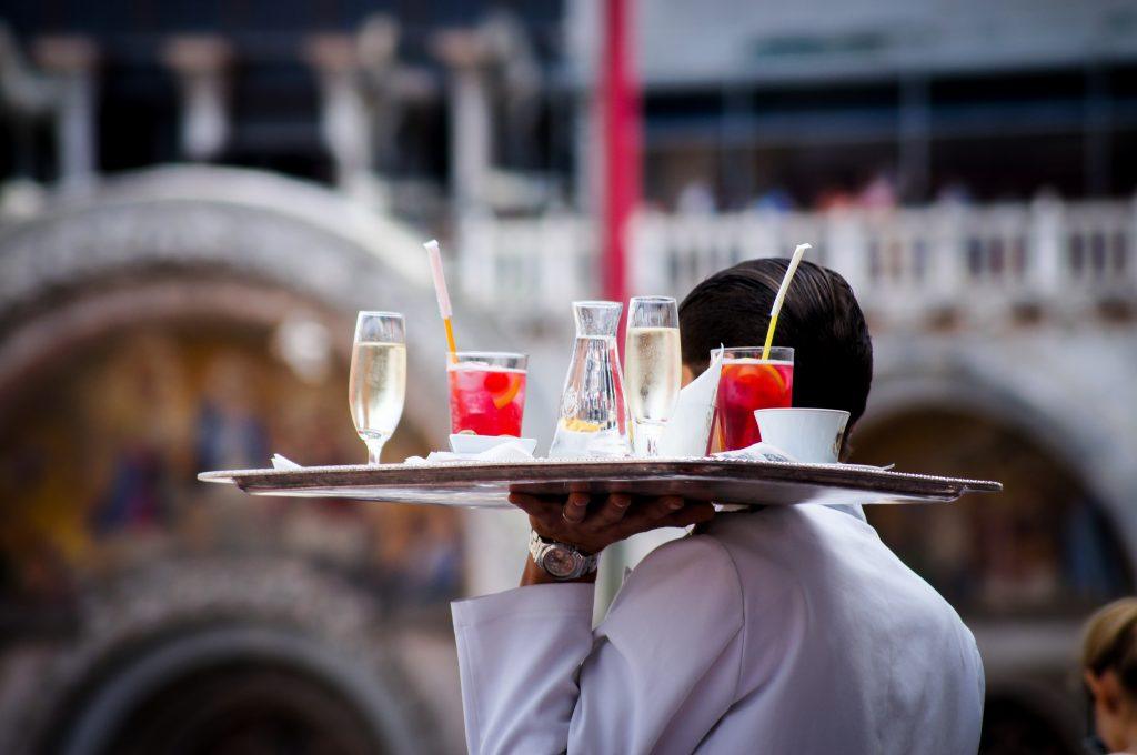 Waiter carrying drinks