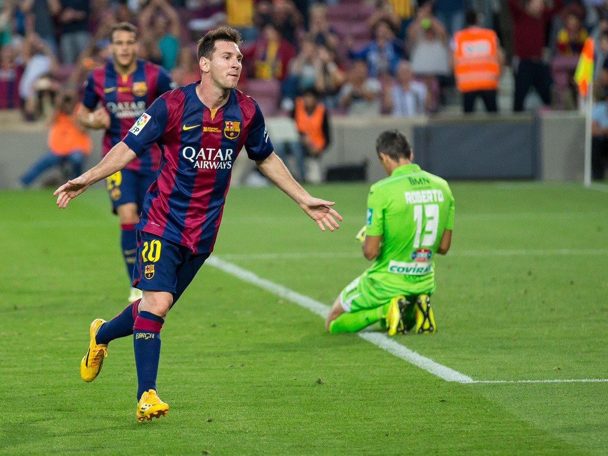 Lionel Messi celebrating scoring a goal against Granada CF
