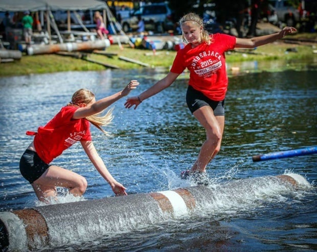 people running on log in water