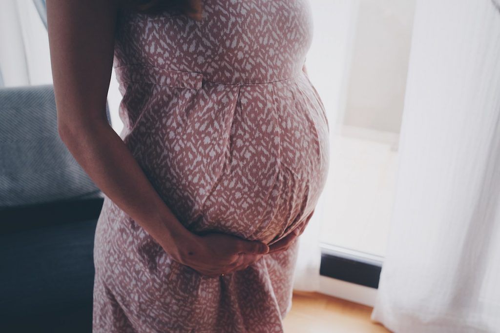 Woman with pregnant belly