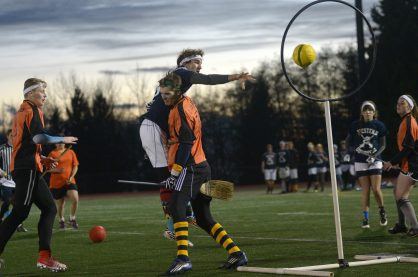 A chaser scoring points during a game of quidditch