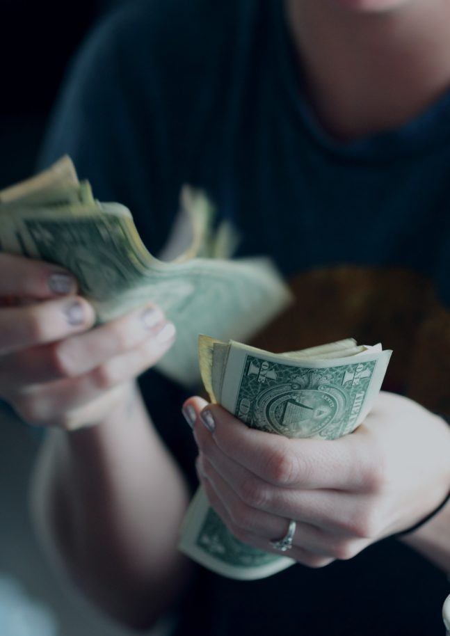 Person counting money