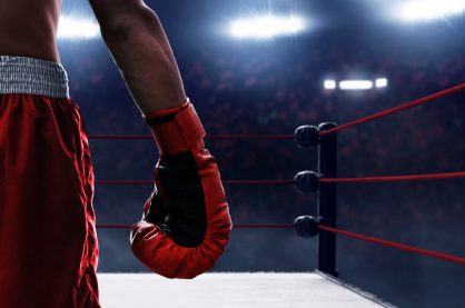 Boxer wearing gloves entering the ring