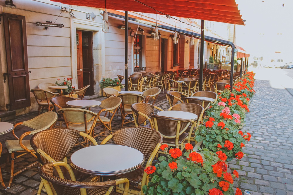 Open outdoors cafe with chairs and tables